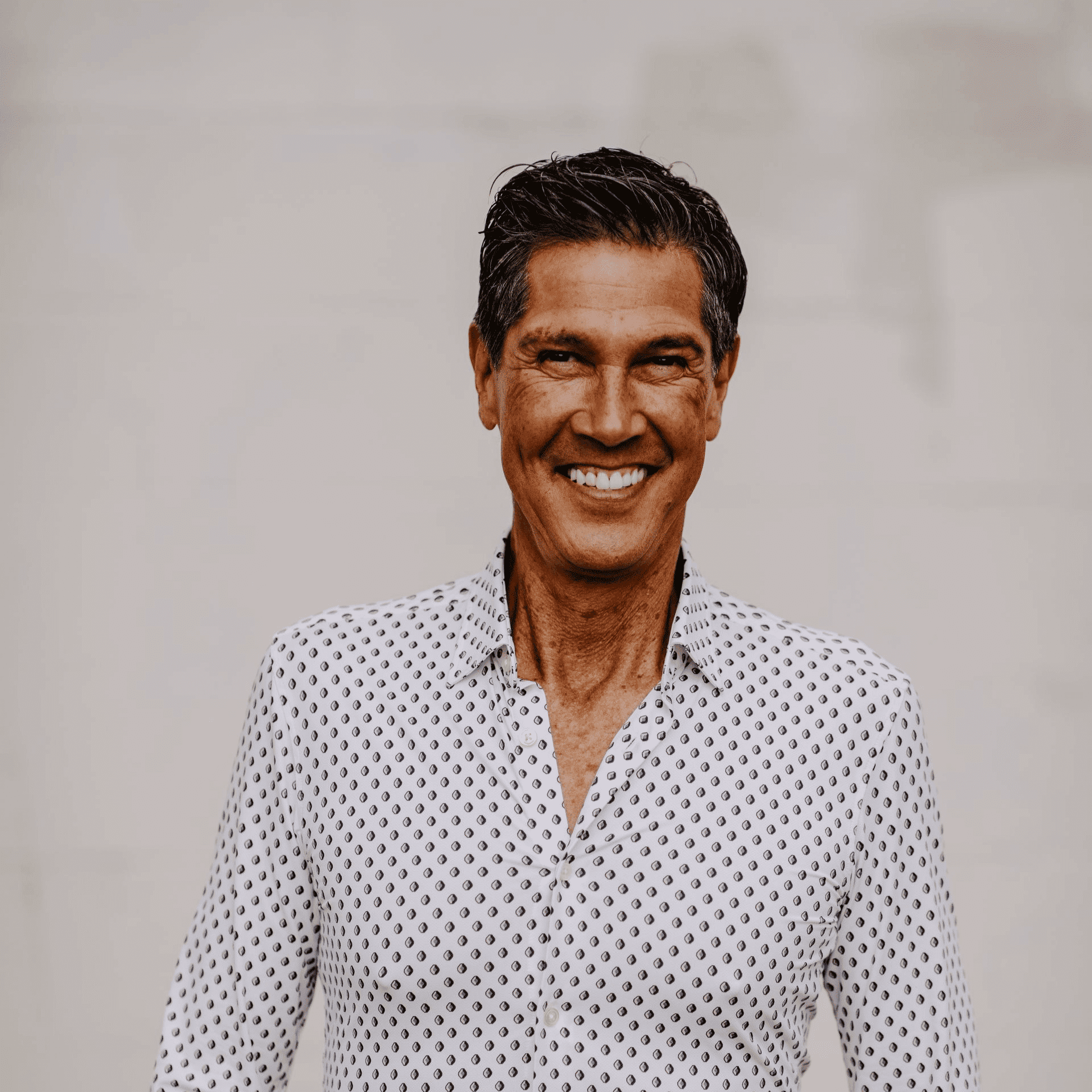 Portrait of R.J. Jones, a professional stylist at Hair Lounge, showcasing their expertise and style.